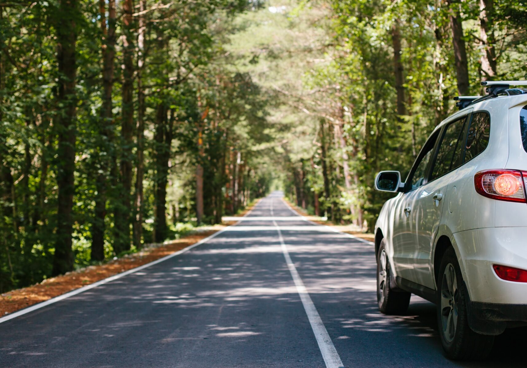 car driving down road