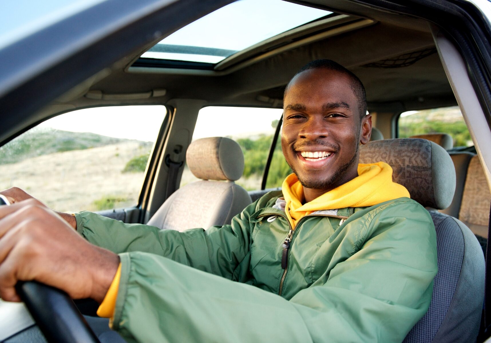 man driving car